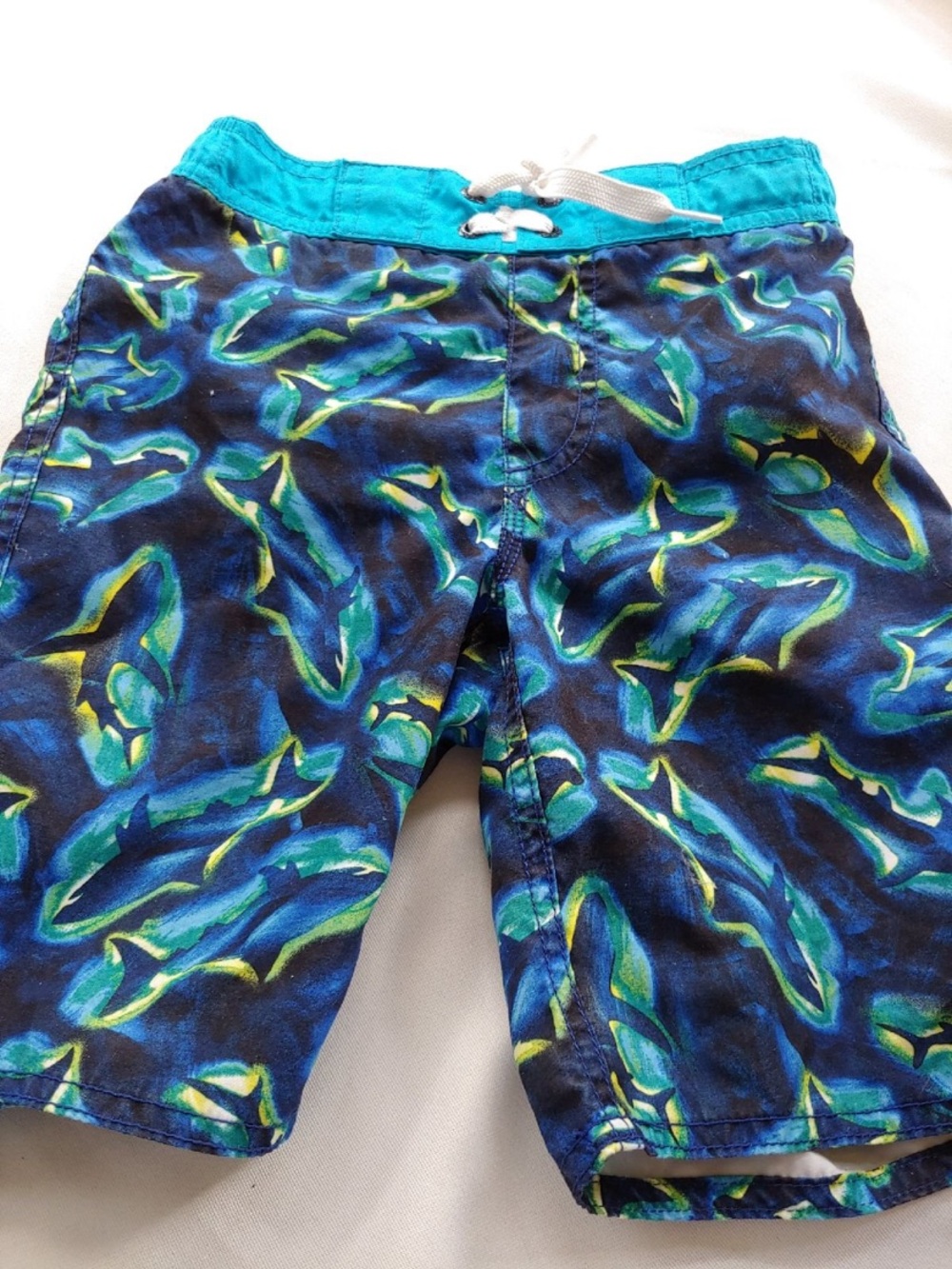 Old Navy size 6 - 7 boys swim trunks
Popular swimming shark design